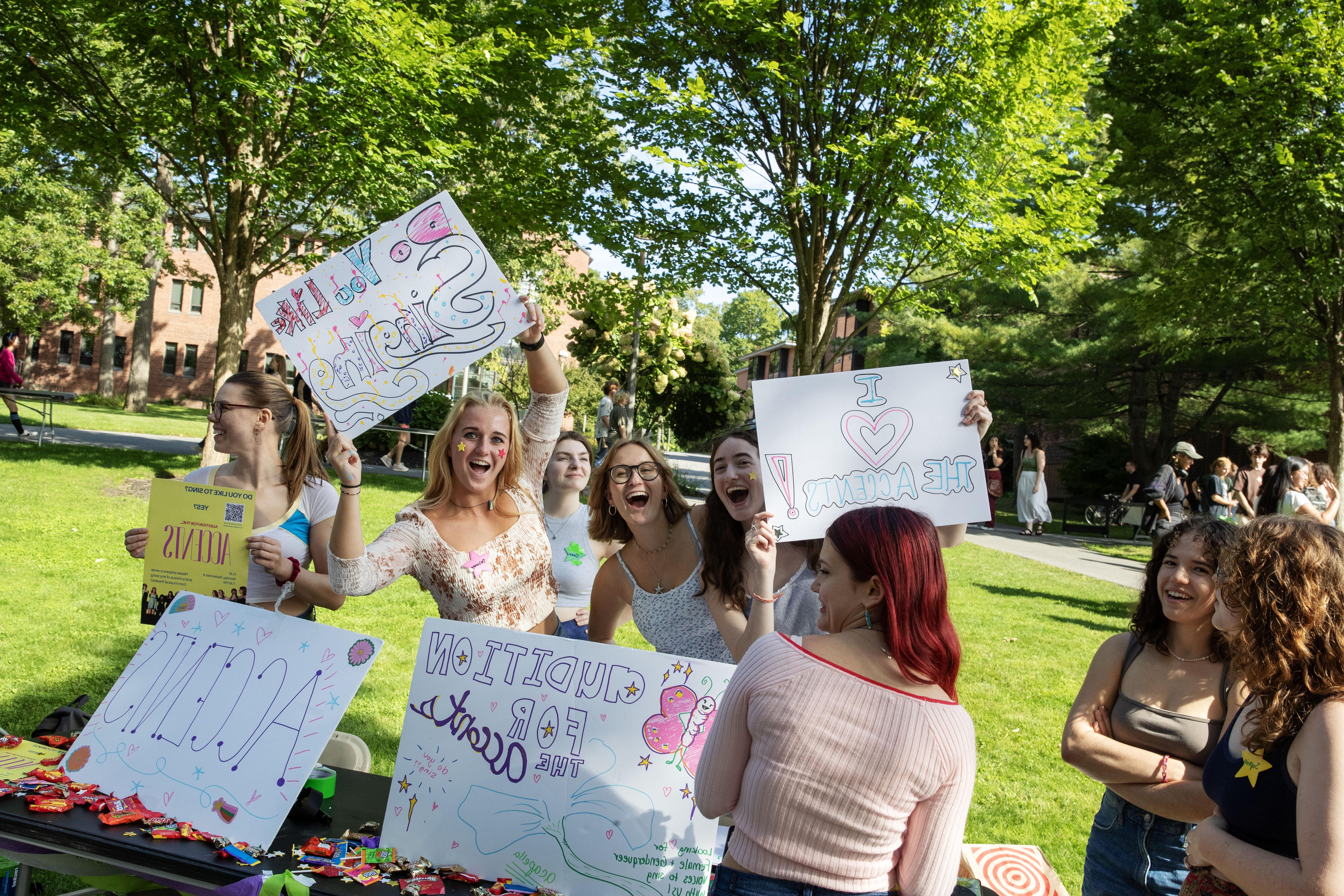 Students advertising a club for singing